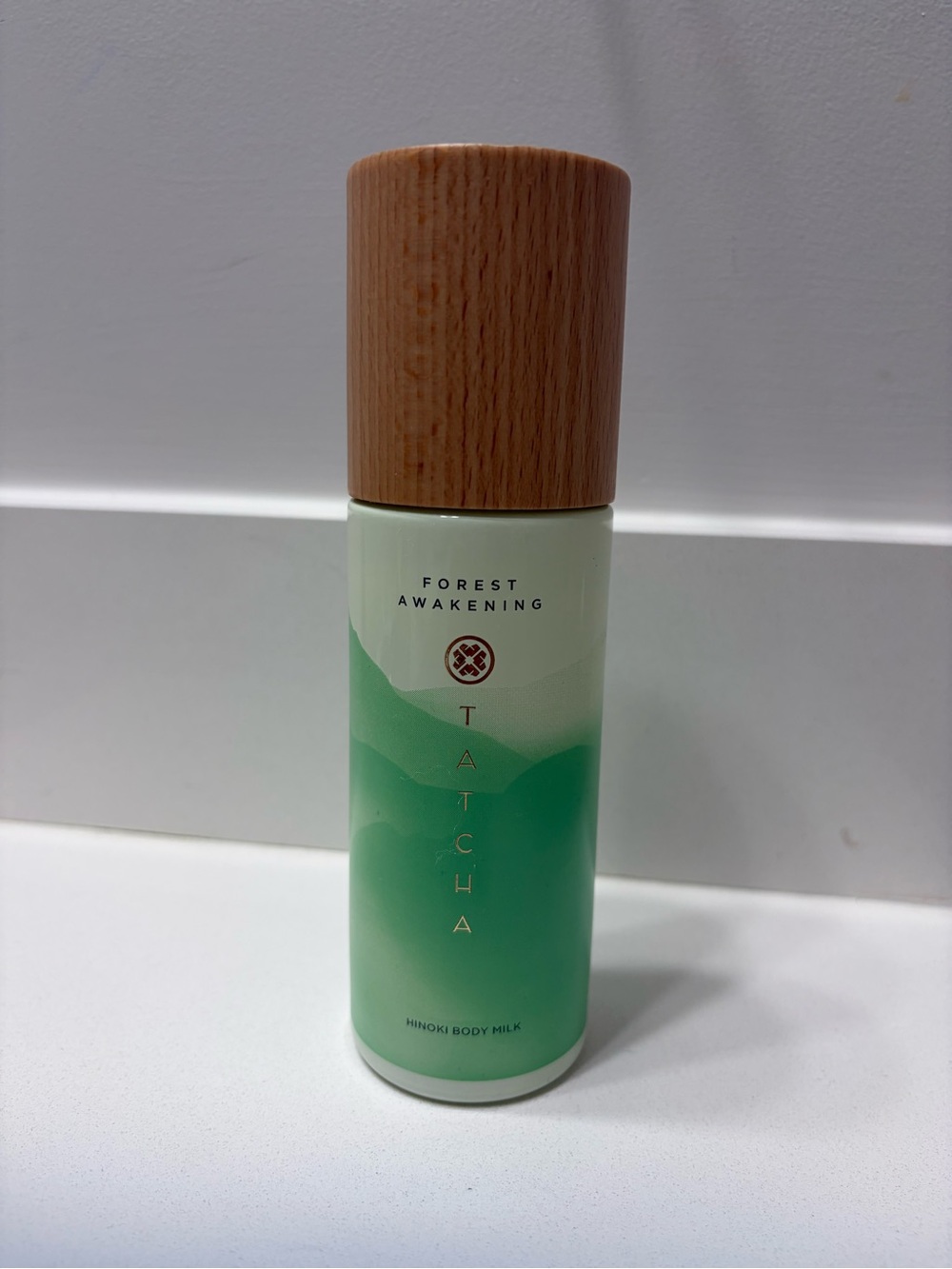 Tatcha Forest Awakening Hinoki Body Milk - light green and wood tone